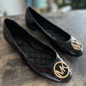 MICHAEL KORS black flats. size 7.5. In perfect condition.